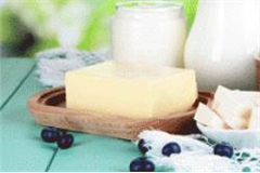 an assortment of butter dishes on a table top, filled with various types of butter