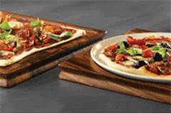 one circular and one square plate on wooden serving boards 