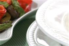 round white plate with salad dish placed beside 