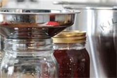 funnel placed in jam jar 