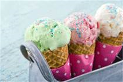 three ice cream cones filled with ice cream