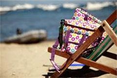 insulated bags on a deck chair on the bench 