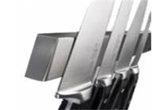 a knife setting hanging on a magnetic knife rack 