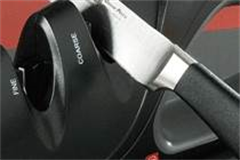 a knife placed in a knife sharpener 