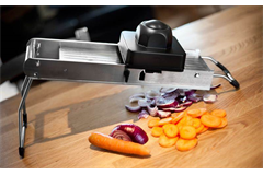 mandolin with sliced carrots and onions 