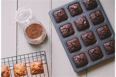 brownie pan and cooling rack filled with brownies 