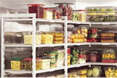wire shelving full of clear containers of food