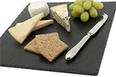 a large square slate with various cheeses on alongside a cheese knife