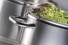 stainless steel pot containing lettuce 