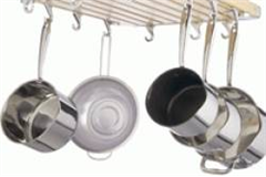 stainless steel pots hanging from a tool rack 