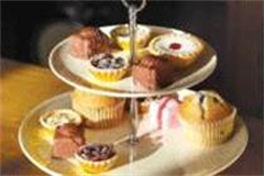 variety of cakes on a cake stand 