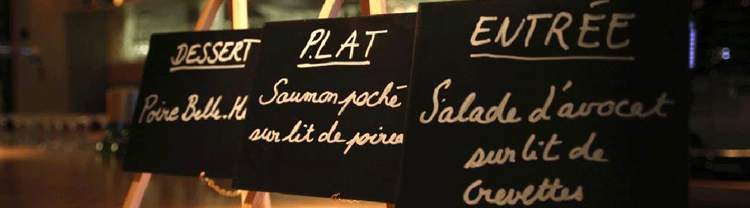 row of three mini black boards on easels advertising a restaurants specials