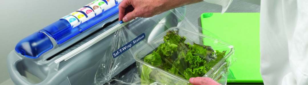 man covering salad with cling film