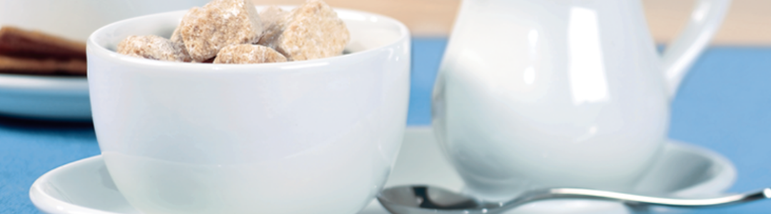 teapot and pot filled with sugar cubes