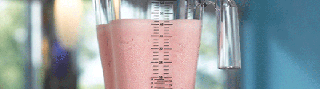 pink drink in a bar blender jug
