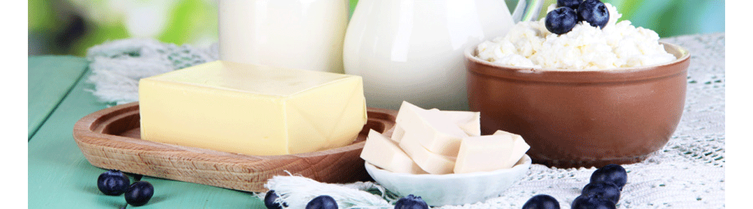 an assortment of butter dishes on a table top, filled with various types of butter 