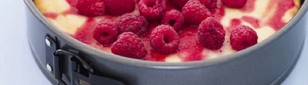 round cake pan with raspberry cake 