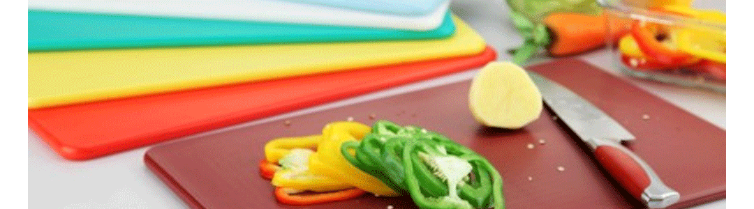 array of rectangular chopping boards with sliced peppers on