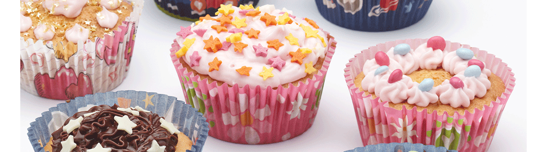 four cupcakes with different decorations