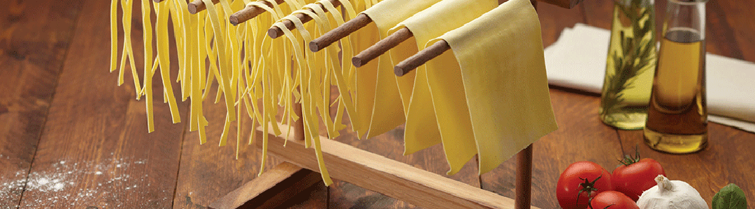 homemade pasta hanging up to dry