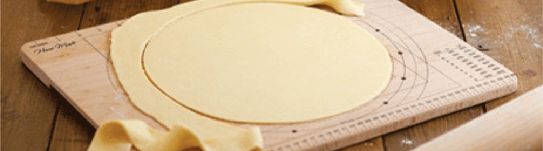 pastry being cut on a pastry cutting board
