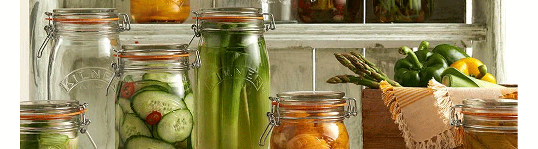 a variety of different size preserve jars side by side 