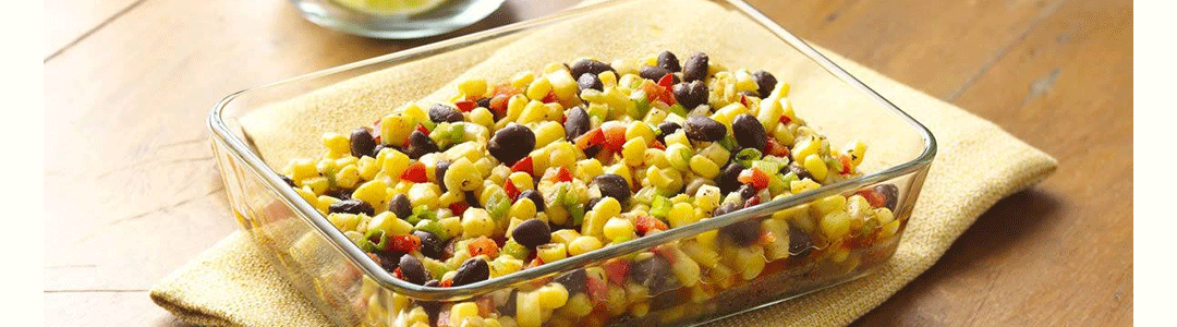 Pyrex glass roasting dish containing cooked vegetable bake