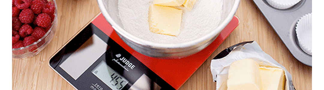 rectangular scales measuring a glass bowl with condiments 