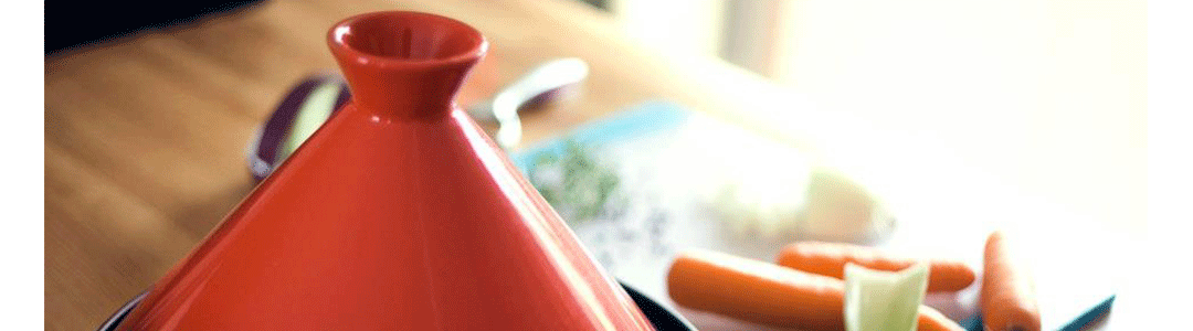 Red tagine on kitchen work top 