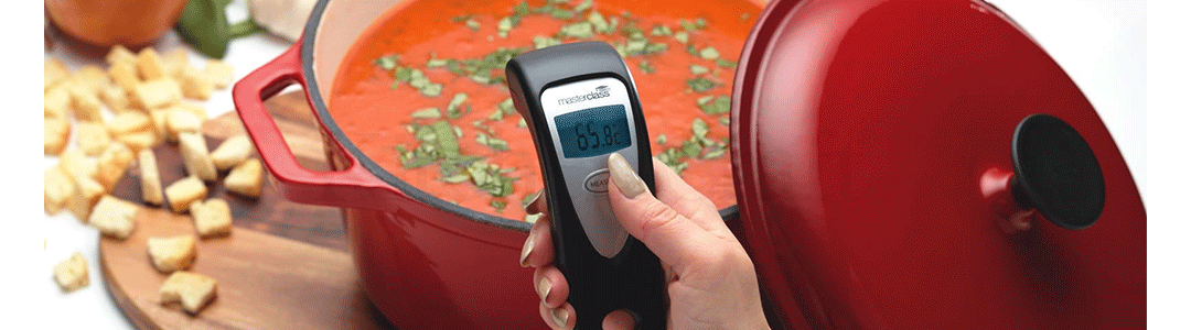 digital thermometer measuring temperature of soup pot 