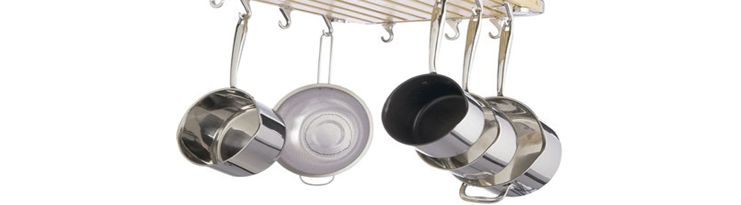 stainless steel pots hanging from a tool rack 